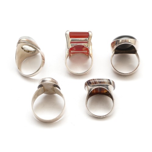 64 - Five silver and stone set rings, including carnelian, O, banded agate and moonstone, 53gm