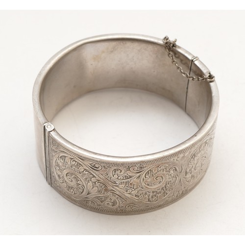 66 - A sterling silver hinged bangle, 55 x 55mm, width 25mm, 41gm