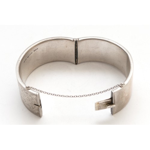 66 - A sterling silver hinged bangle, 55 x 55mm, width 25mm, 41gm