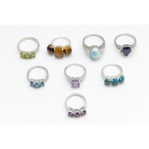 72 - Eight various silver gemset rings, including larimar and sapphire, N - R, 32gm