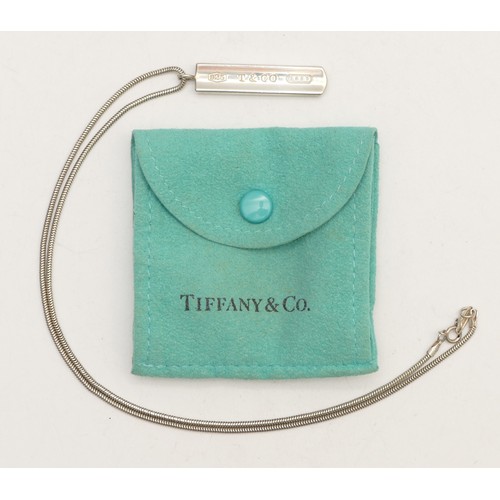 77 - Tiffany & Co., a silver bar pendant, dated 2001, chain, 13gm, pouch.