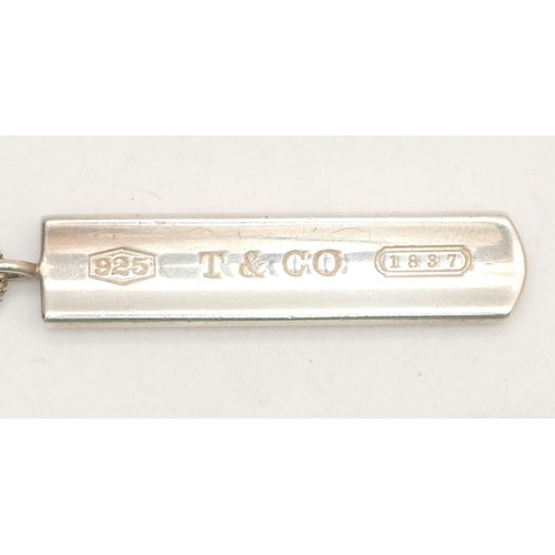 77 - Tiffany & Co., a silver bar pendant, dated 2001, chain, 13gm, pouch.