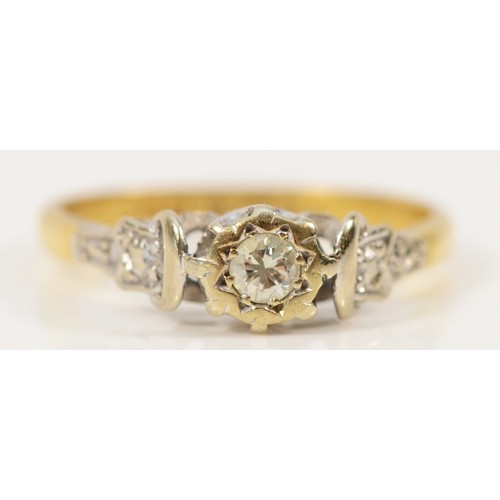 571 - An 18ct gold and platinum brilliant cut diamond solitaire ring with patterned shoulders, Birmingham ... 