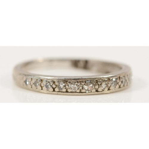 572 - A .950 platinum diamond half eternity ring, K, misshapen band, 1.9g