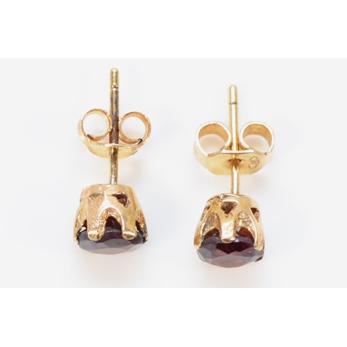 573 - A pair of 9ct gold garnet earrings with scroll backs, 5mm garnet, 1.1g