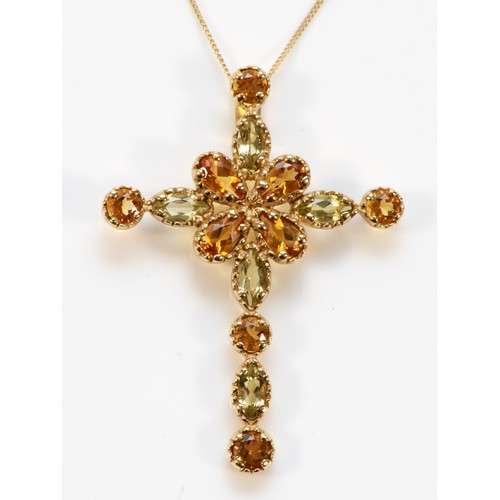 579 - A 9ct gold vari hue citrine cross pendant with chain, 35mm cross length, 3.2g