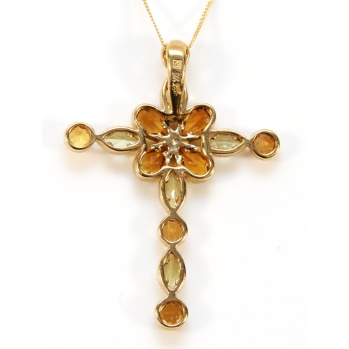 579 - A 9ct gold vari hue citrine cross pendant with chain, 35mm cross length, 3.2g