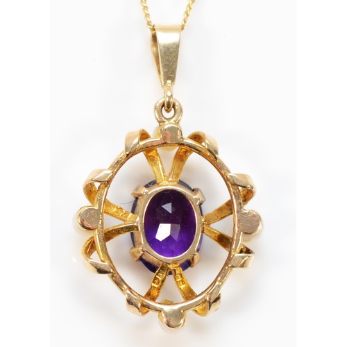 581 - A 9ct gold amethyst and seed pearl pendant with chain, 20mm pendant length, 2.7g