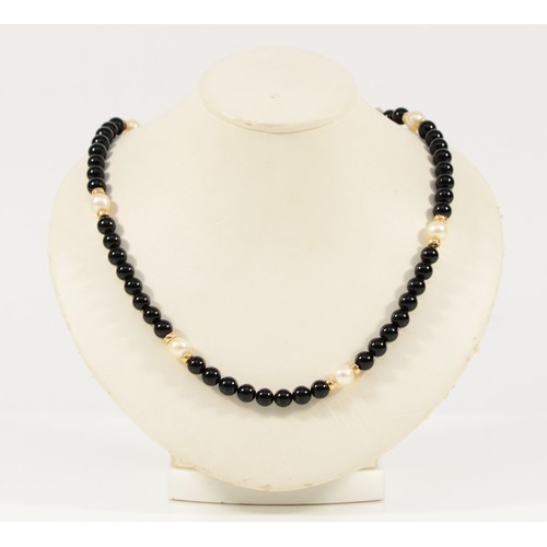 586 - A 9ct gold clasp black onyx and cultured pearl beaded necklace, 4mm beads, 20.1g