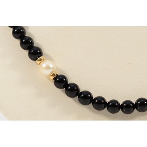 586 - A 9ct gold clasp black onyx and cultured pearl beaded necklace, 4mm beads, 20.1g