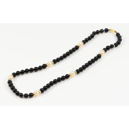 586 - A 9ct gold clasp black onyx and cultured pearl beaded necklace, 4mm beads, 20.1g