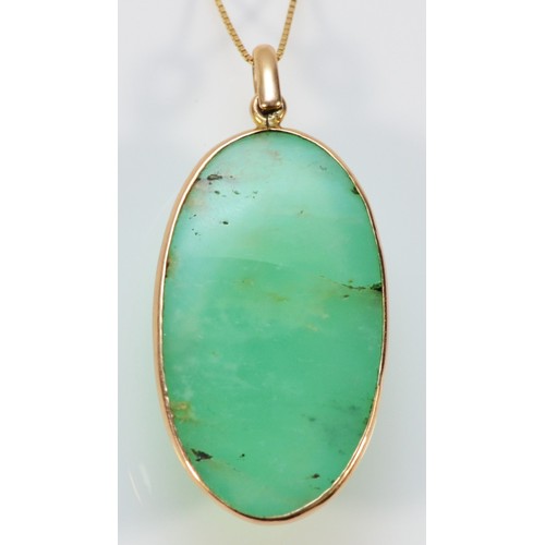 587 - A 14k gold green gemstone pendant, 30mm x 15mm, 7.9g