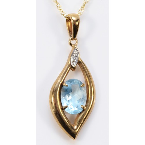 594 - A 9ct gold topaz pendant with 9ct gold chain, 8mm x 6mm topaz, 1.7g