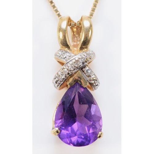 595 - A 9ct gold pear cut amethyst pendant with a 9ct gold chain, 10mm x 7mm amethsyt, 3.2g