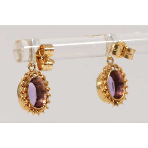 598 - A pair of 9ct gold oval cut amethyst drop earrings with scroll backs, 6mm x 4mm amethyst, 1.6g