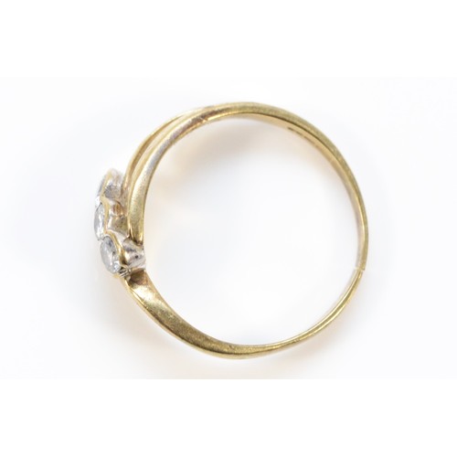 603 - A 9ct gold vintage brilliant cut diamond three stone ring, spilt to the band, J 1/2, 1.9g