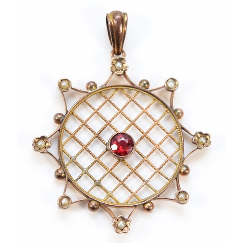 608 - A 9ct gold antique garnet topped doublet and seed pearl pendant, 33mm diameter, 3.4g