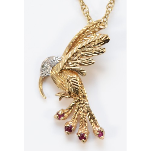 616 - A 9ct gold ruby and diamond pendant in the shape of a bird, with a 9ct gold chain, 26mm total length... 