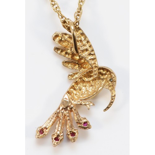 616 - A 9ct gold ruby and diamond pendant in the shape of a bird, with a 9ct gold chain, 26mm total length... 