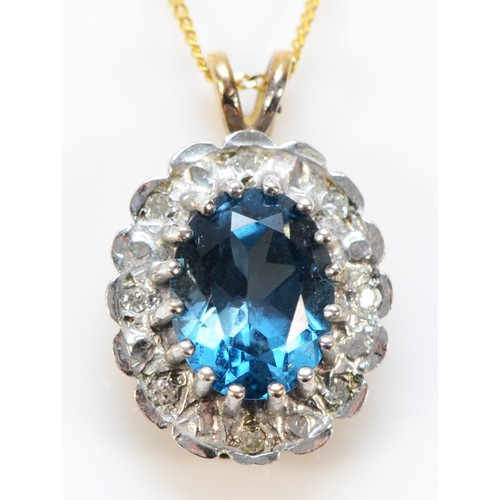 620 - A 9ct gold blue topaz and diamond cluster pendant with chain, 13mm cluster, 2.8g