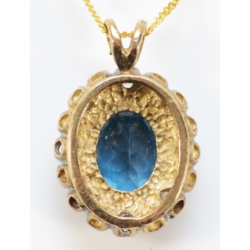 620 - A 9ct gold blue topaz and diamond cluster pendant with chain, 13mm cluster, 2.8g