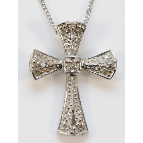 621 - A 9ct white gold diamond cross pendant with chain, 23mm cross length, 3g