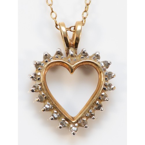 623 - A 9ct gold vintage diamond heart shaped pendant with chain, 16mm across, 2.9g