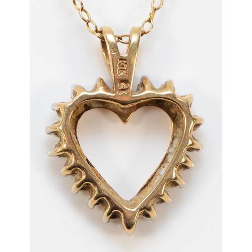 623 - A 9ct gold vintage diamond heart shaped pendant with chain, 16mm across, 2.9g