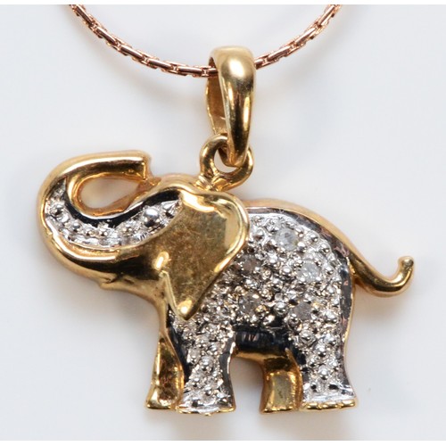 629 - A 9ct gold pave set diamond elephant pendant with chain, 16mm across, 2g