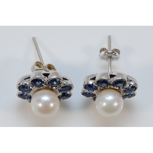 630 - A pair of 18ct white gold sapphire and cultured pearl cluster earrings with 9ct white gold scroll ba... 