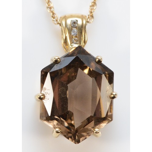 632 - A 9ct gold smokey quartz and white sapphire pendant with a 9ct gold chain, 15mm x 12mm quartz, 4.8g