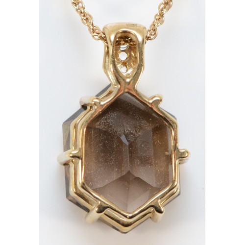 632 - A 9ct gold smokey quartz and white sapphire pendant with a 9ct gold chain, 15mm x 12mm quartz, 4.8g