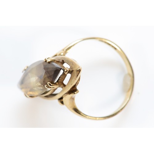 637 - A 9ct gold marquise cut smokey quartz cocktail ring, 20mm x 7mm quartz, L, 3.6g