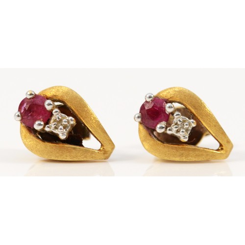 652 - A pair of 18ct gold ruby and diamond earrings with scroll backs, 10mm length, 2.5g