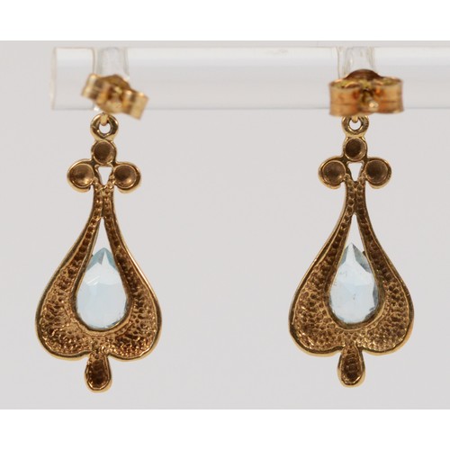 653 - A pair of 9ct gold vintage style blue topaz drop earrings with scroll backs, 25mm total drop, 2.3g