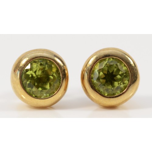 655 - A pair of 9ct gold peridot earrings with scroll backs, 7mm diameter, 2.3g