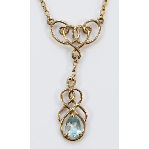 659 - A 9ct gold blue topaz knot necklace, 8mm x 5mm topaz, 37mm pendant drop, 3.4g