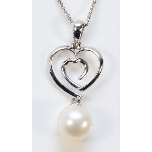 660 - An 18ct white gold cultured pearl open heart pendant with chain, 23mm total pendant length, 3.1g