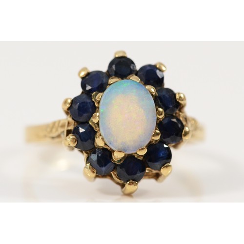 663 - A 9ct gold opal and sapphire cluster ring, M, 2.9g