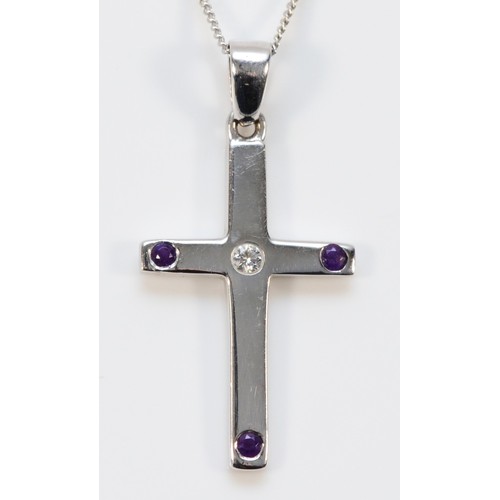 664 - A 9ct white gold brilliant cut diamond and amethyst cross pendant, 25mm cross length, 3.8g