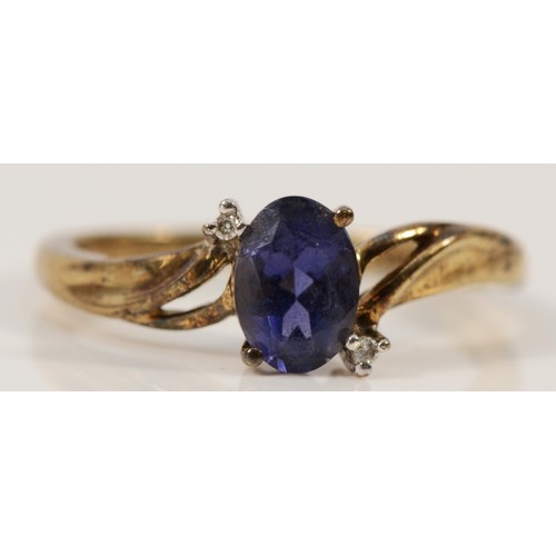 667 - A 9ct gold iolite dress ring with diamonds, N, 2g