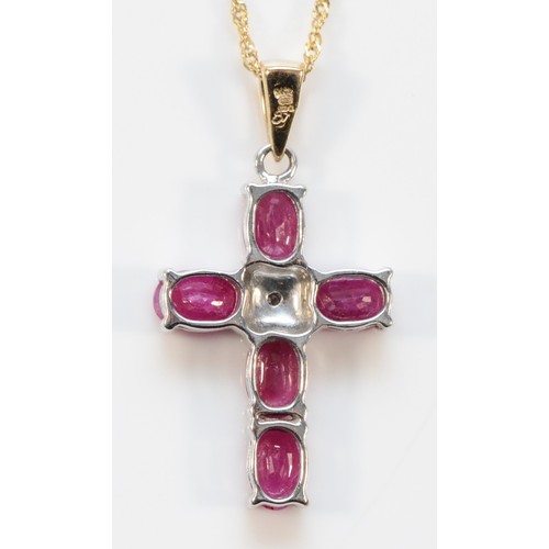 668 - A 9ct gold diamond and ruby cross pendant with chain, 23mm cross length, 3.5g