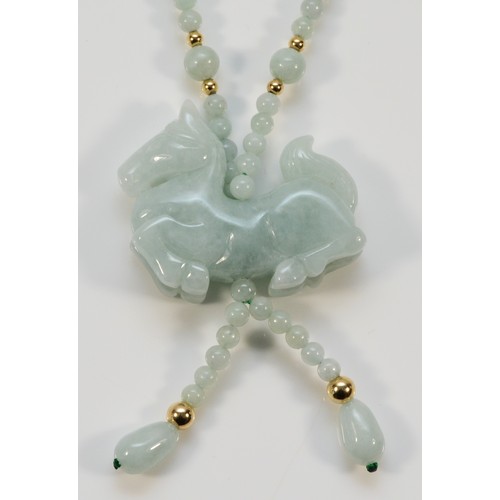 676 - A 14k gold clasp jade bead necklace with a carved jade horse pendant, horse is 40mm across, 2g