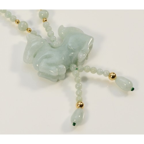 676 - A 14k gold clasp jade bead necklace with a carved jade horse pendant, horse is 40mm across, 2g