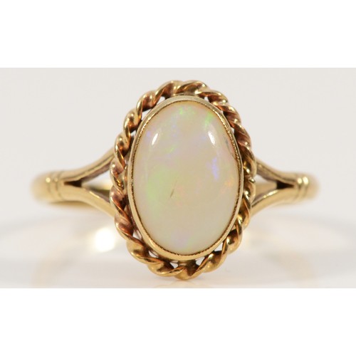 677 - A 9ct gold opal single stone ring with rope edging detail, 11mm x 7mm opal, S, 3.2g