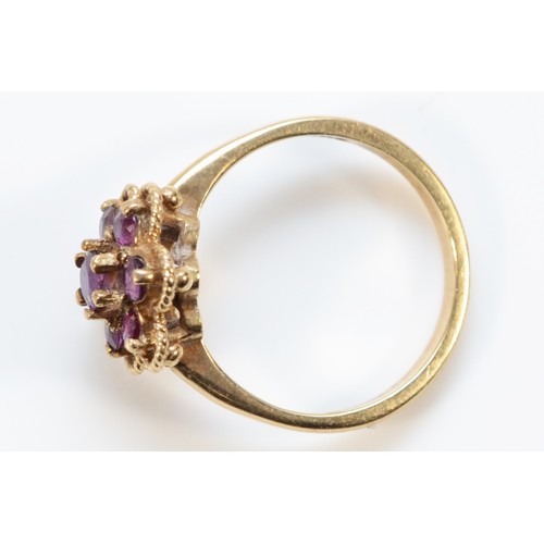 680 - A 9ct gold vintage ruby floral cluster ring, London 1975, L, 3g