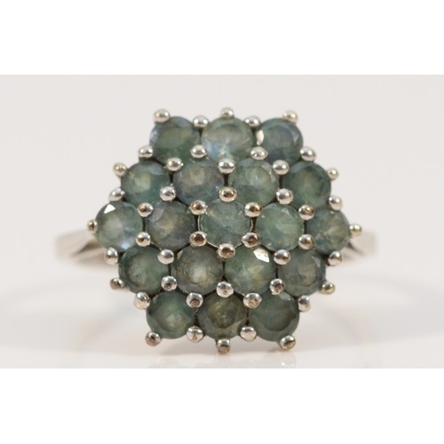 697 - A 9ct white gold green gemstone cluster ring, 15mm ring front, N, 3.3g