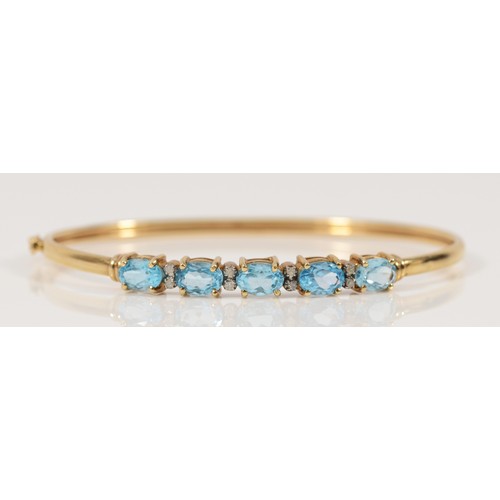 698 - A 9ct gold rolled bracelet, diamond and topaz, 7mm x 5mm topaz, 6.8g