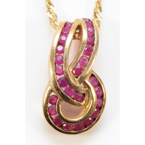 705 - A 9ct gold ruby twist pendant with chain, 20mm pendant length, 4.1g