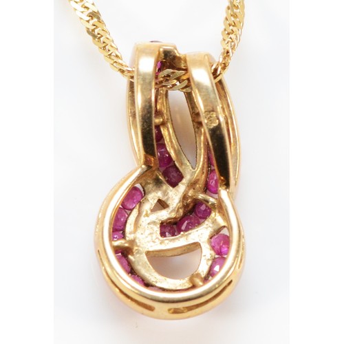 705 - A 9ct gold ruby twist pendant with chain, 20mm pendant length, 4.1g